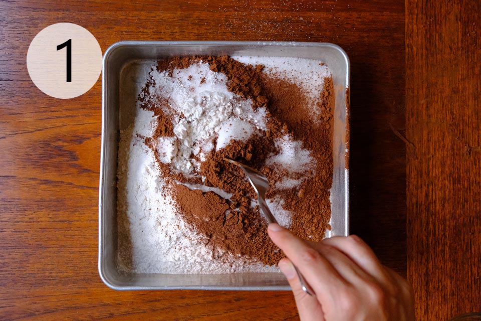 Instructions to make Chocolate Wacky Cake - Sift Dry Ingredients