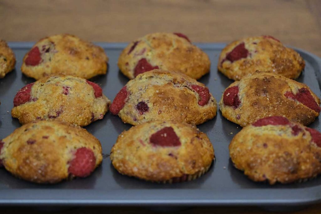 Tray of Orange and Raspberry Muffins