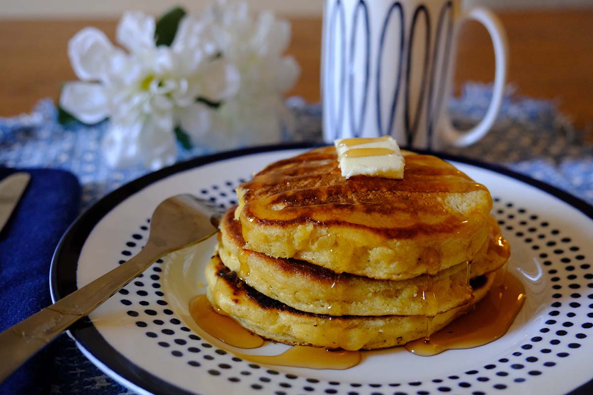 Stack of Cornmeal Pancakes with butter