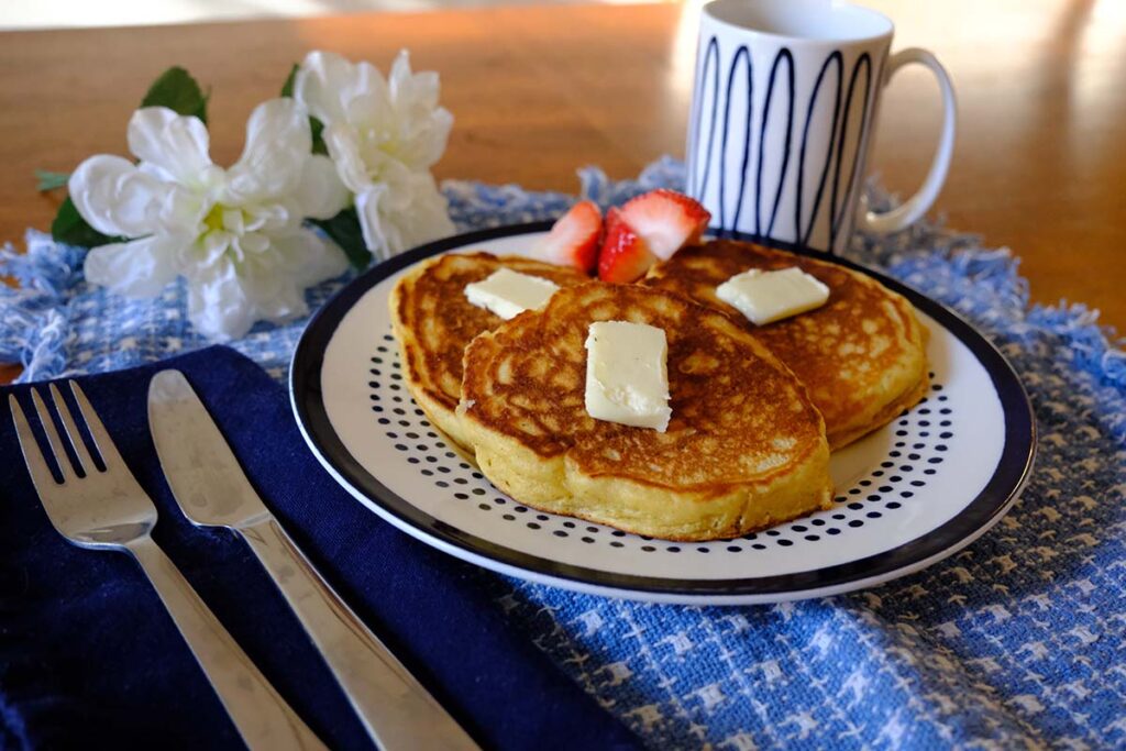Plate of Fluffy Cornmeal Pancakes with butter