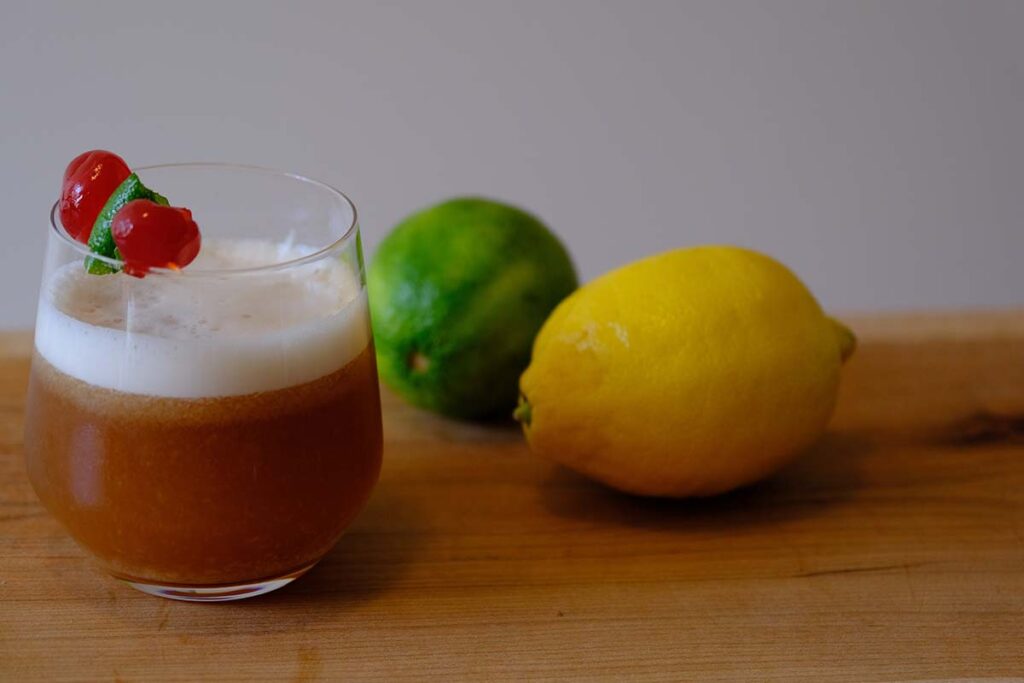 tequila sour cocktail with lemon and lime