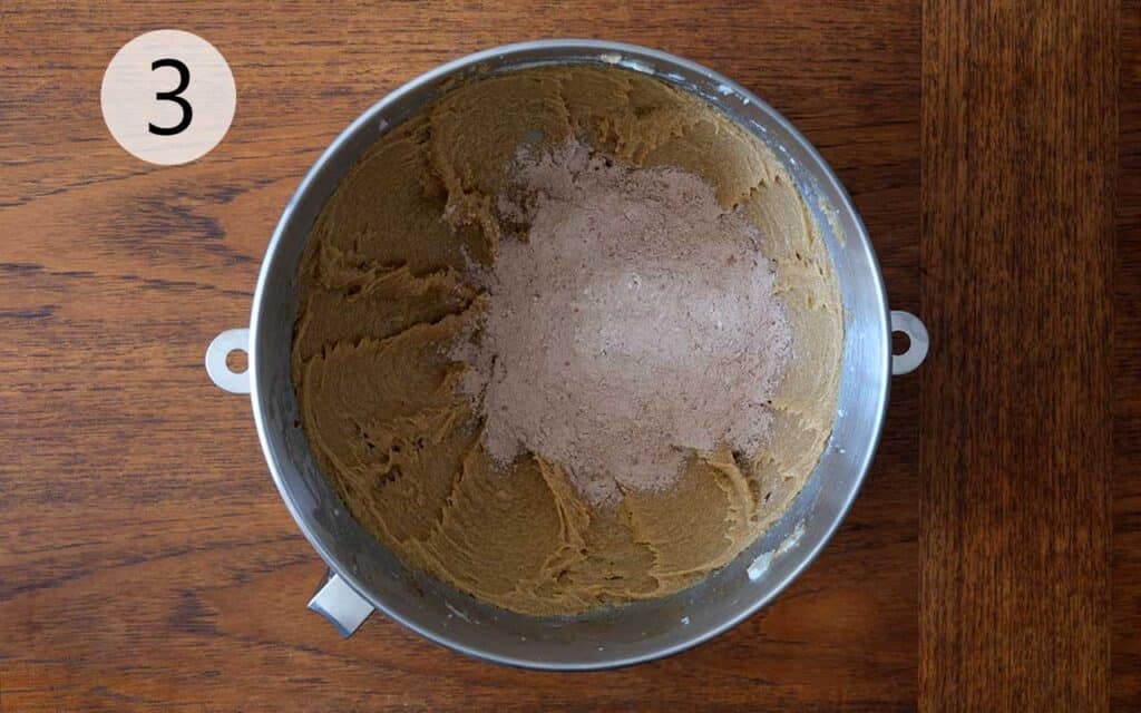 Blending dry cocoa mixture into wet butter and sugar mixture to form Mexican Chocolate Cookie dough.