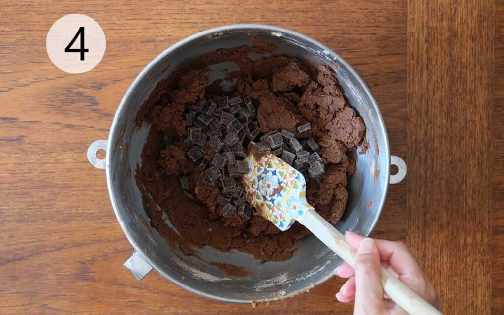 Stirring dark chocolate chunks into Mexican Chocolate Cookie dough for melty chocolate pockets.