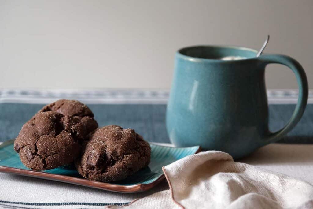 Homemade Mexican Chocolate Cookies on a blue plate, perfect for Christmas baking and cookie boxes
