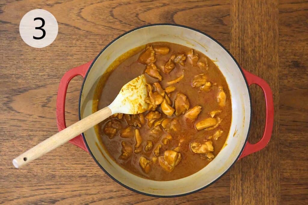 Stirring coconut milk, fish sauce, tamarind paste, and brown sugar into the curry base for a creamy, flavorful Thai Massaman Curry.