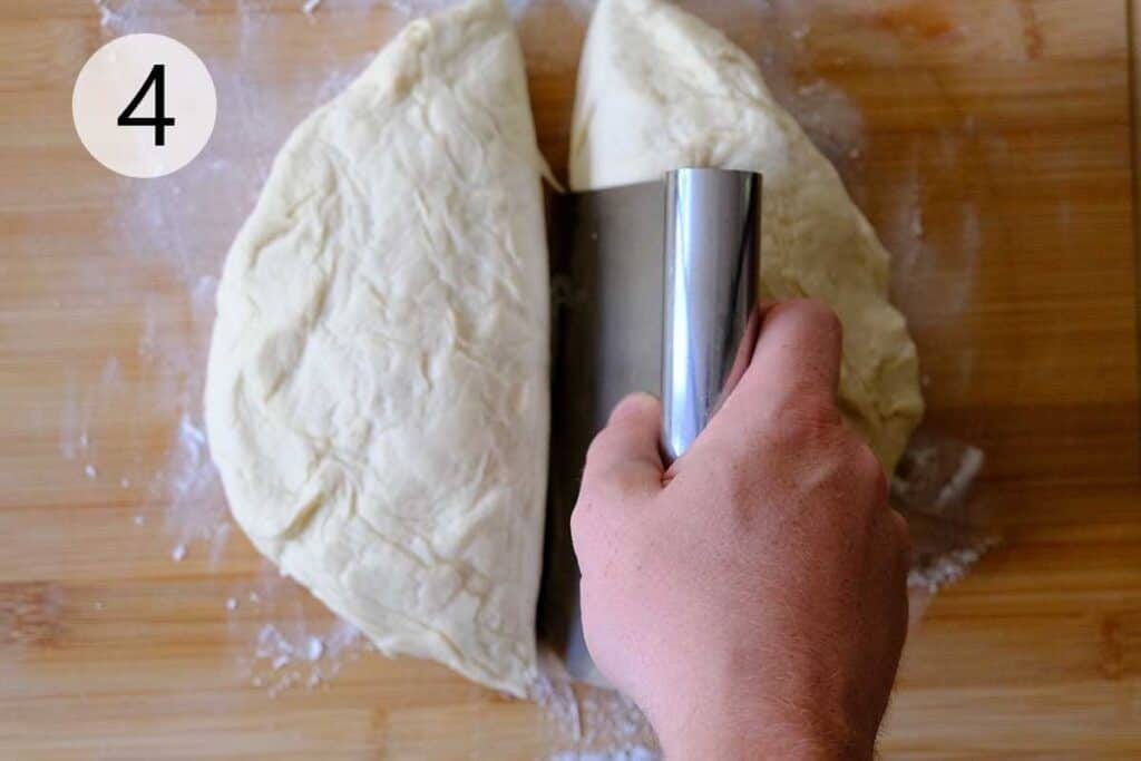 Dividing thin crust pizza dough into two portions and shaping into smooth balls for homemade pizza.