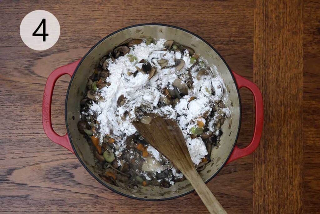 Vegetables coated with flour in a pot to create a velvety base for the wild mushroom soup recipe.