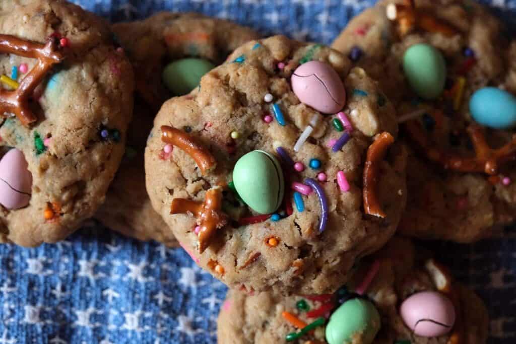 Close up shot of Cadbury Mini Egg Cookie against a blue background.