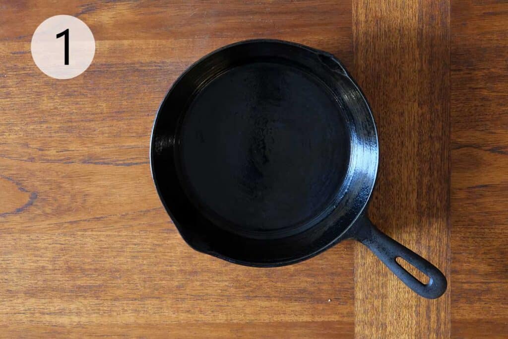 Cast iron skillet prepared to be heating in oven