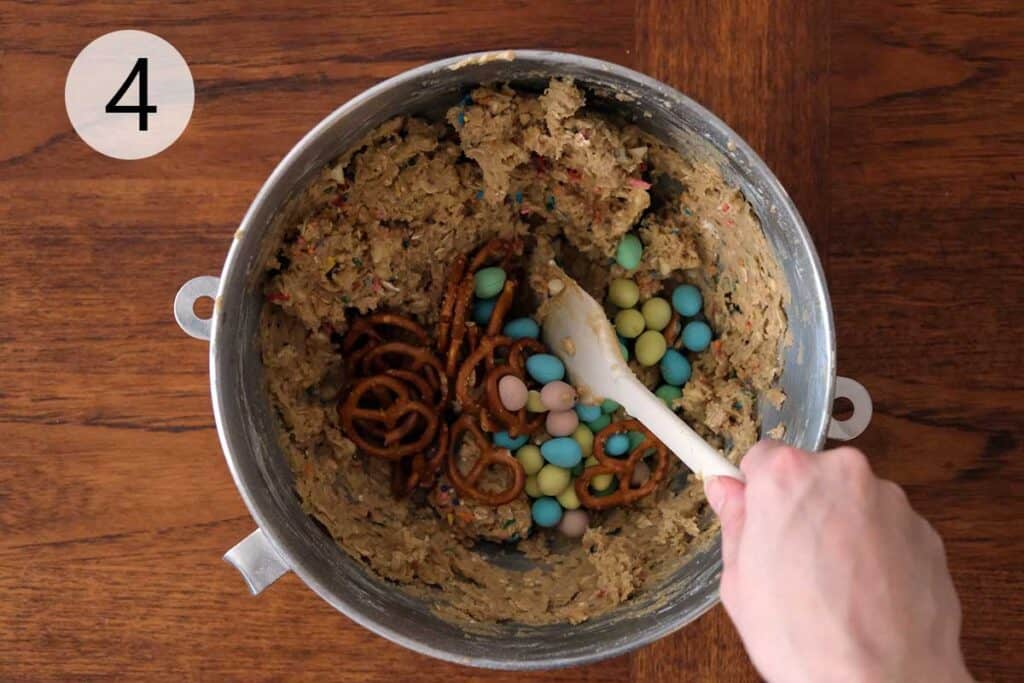Adding Cadbury Mini Eggs, Prezels and White Chocolate to cookie dough
